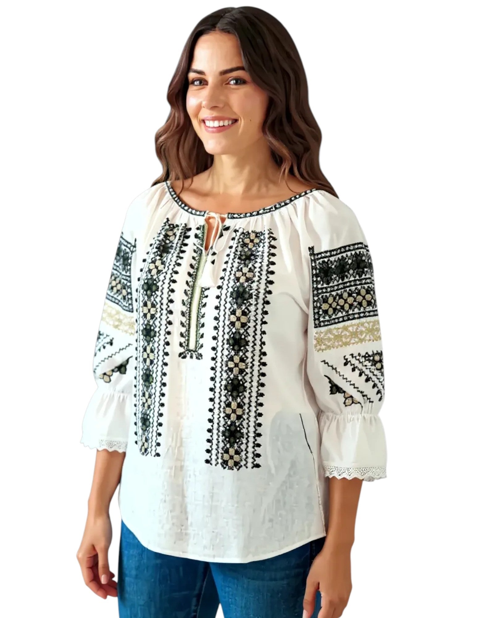 Woman wearing a white blouse with black and gold embroidery on a white background