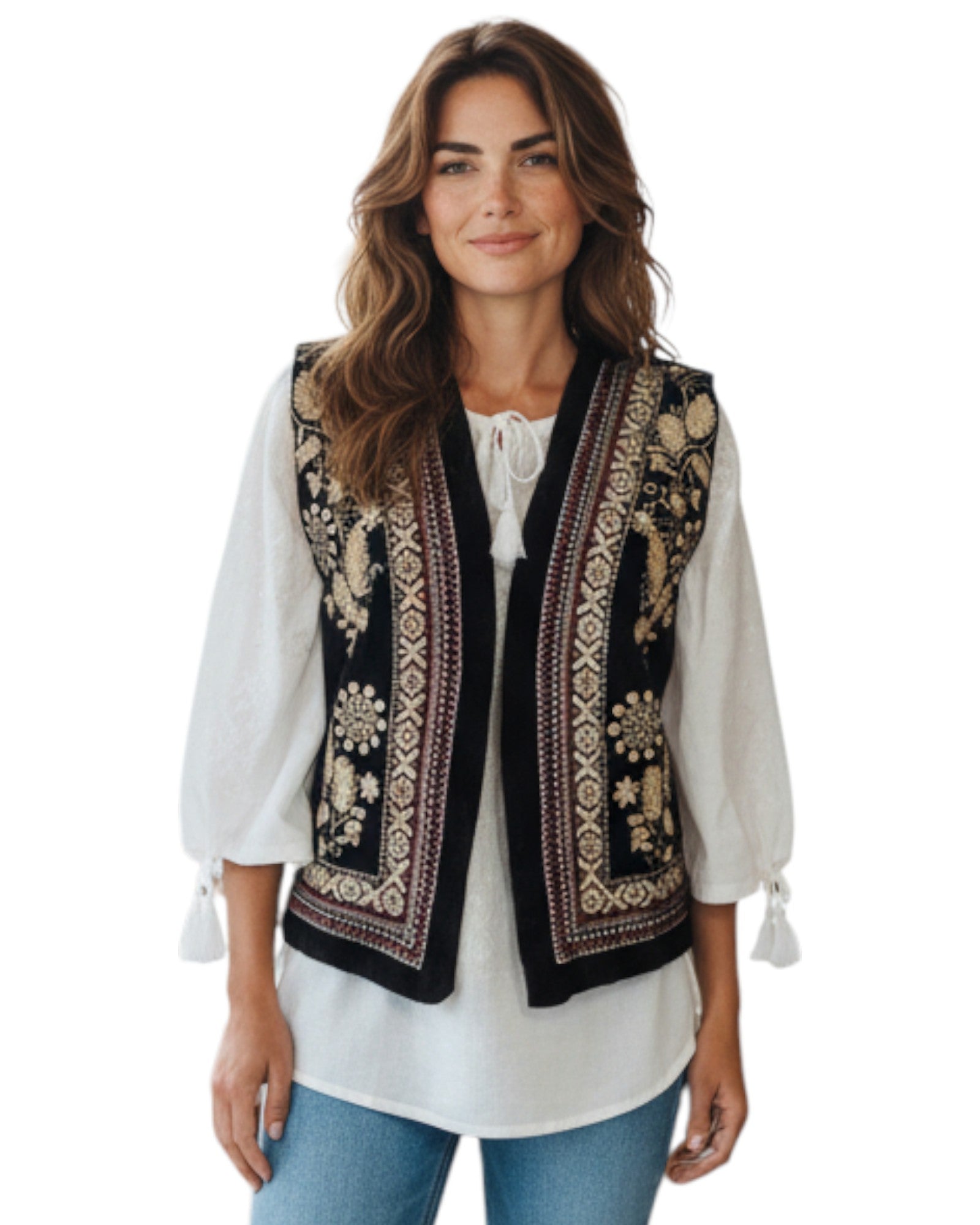 Woman wearing a black embroidered vest over a white blouse on a white background